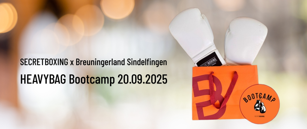 Ankündigung HEAVYBAG Bootcamp bei Breuningerland Sindelfingen, orange Breuningertüte mit 2 weißen Boxhandschuhen von SECRETBOXING, Bootcamplogo